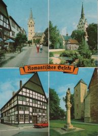 Hier geht es zur Karte mit dem Motiv 'Kirchen und Häuser unter blauem Himmel' Hier geht es zur Karte mit dem Motiv 'Kirchen und Häuser unter blauem Himmel'
