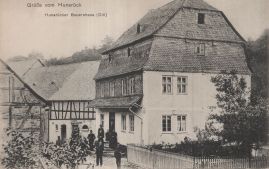 Hier geht es zur Karte mit dem Motiv 'Menschen vor Hunsrücker Bauernhaus' Hier geht es zur Karte mit dem Motiv 'Menschen vor Hunsrücker Bauernhaus'